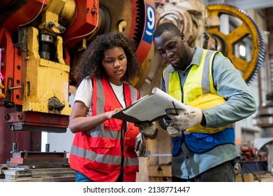 African Workers Working Team Service And Discussing Plan Of Maintenance Machine In Heavy Industrial Factory