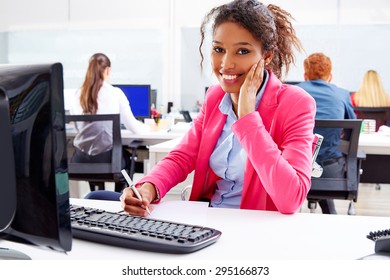 african young businesswoman working in office with computer - Powered by Shutterstock