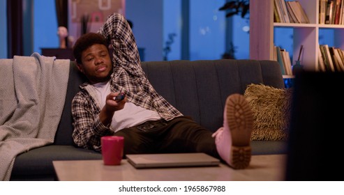 African Young Handsome Man College Student Business Guy Staying Home Leisure Afternoon Nihght Avctivity Watching TV Football Game Alone At Home.