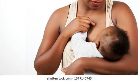 African young  Mother breastfeeding her little baby in her arms.