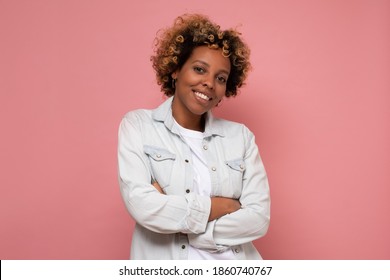 African Young Woman With Shaggy Hairstyle Smiling Cheerfully, Feeling Happy And Carefree. Studio Shot.