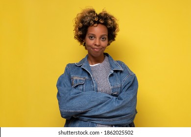 African Young Woman With Shaggy Hairstyle Smiling Cheerfully, Feeling Happy And Carefree. Studio Shot.