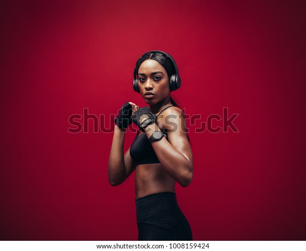 African Young Woman Wearing Boxing Gloves Stock Photo 1008159424 ...