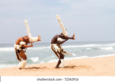 african zulu man dancing on beach