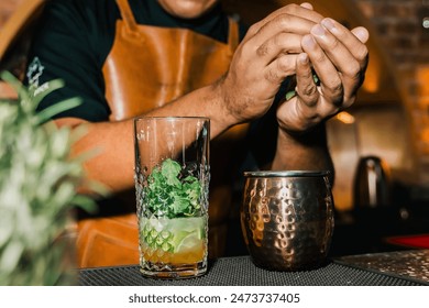 African-American bartender preparing cocktails at the bar, at an afrobeats event. Nightlife, partying and bartending. Style. - Powered by Shutterstock