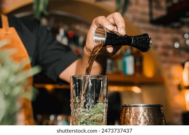 African-American bartender preparing cocktails at the bar, at an afrobeats event. Nightlife, partying and bartending. Style. - Powered by Shutterstock