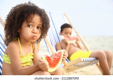 African-American Children Eating Watermelon On Sea Beach