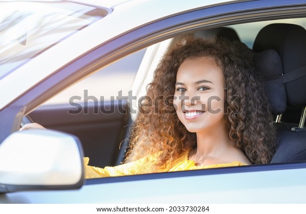 African-American female driver in\
car
