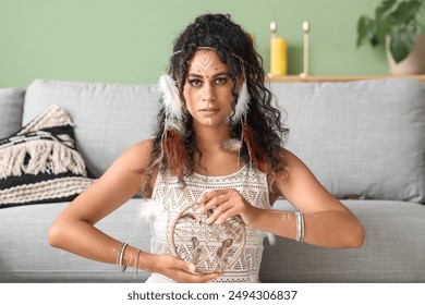 African-American female shaman performing ritual at home - Powered by Shutterstock