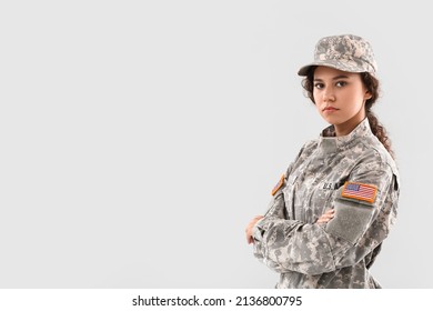 African-American female soldier on light background - Powered by Shutterstock