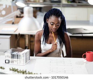 African-american girl in design and engineering architecture office.