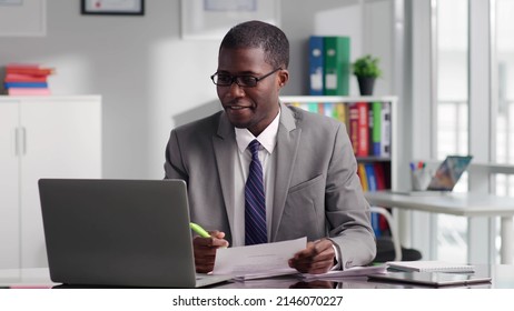 African-American Lawyer Having Online Meeting With Client Using Laptop. Portrait Of Financial Advisor Discuss Investment Strategy With Client On Video Conference