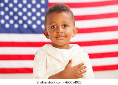 African-American little boy with American flag on a background - Powered by Shutterstock