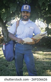 An African-American Mail Carrier On His Route, Santa Monica, CA