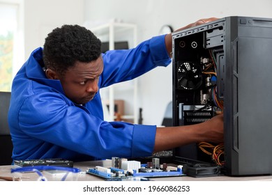 African-American technician repairing computer in service center - Powered by Shutterstock