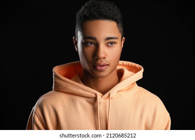 African-American Teenage Boy In Hoodie On Black Background