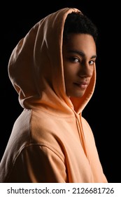 African-American Teenage Boy In Hoodie On Black Background