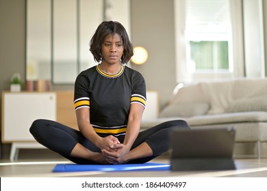 African-american Woman Doing Virtual Fitness Exercices, Digital Class On Tablet