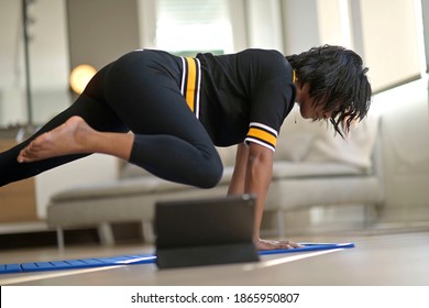 African-american Woman Doing Virtual Fitness Exercices, Digital Class On Tablet