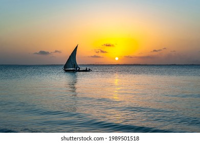 Afrikan fishing sailboat Ngalawa  on beaitiful sunset background near Mnemba island, Tanzania - Powered by Shutterstock