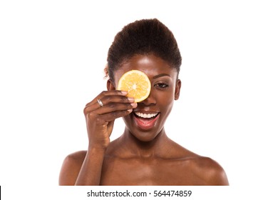 Afro American Black Woman Posing With Two Slices Of Lemon On White Background For Skin And Body Care