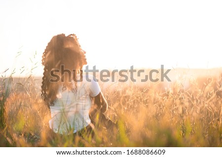 Similar – Image, Stock Photo Young woman looking at the sunset.