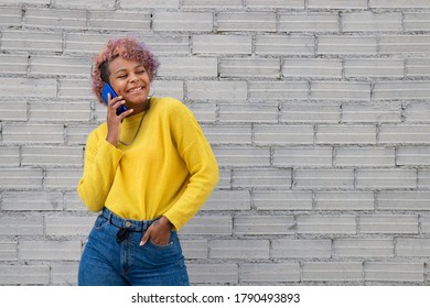 afro american girl on the street with mobile phone - Shutterstock ID 1790493893