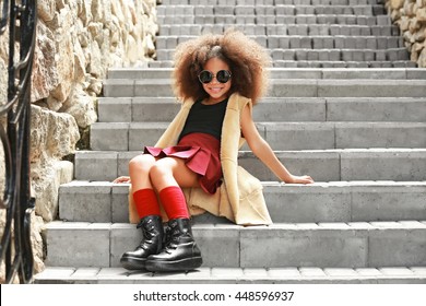 Afro American  Little Girl Wearing Stylish Clothes Outdoors. Fashion Kid Concept