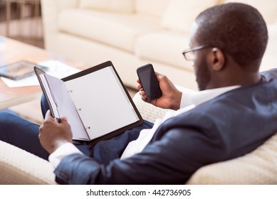 Afro American Man Holding A Folder