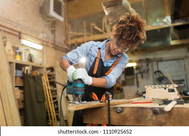 Afro american woman craftswoman working in her workshop - Shutterstock ID 1110925652