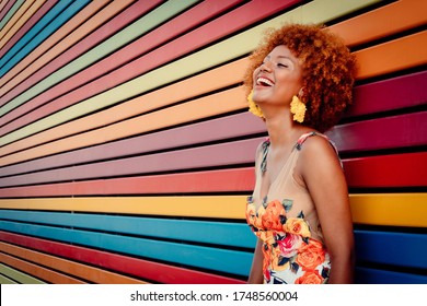 afro american woman fashion cool very happy smiling, brunette woman frizzy hair, curly hair young