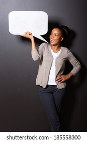 Afro American Woman Holding Speech Bubble Isolated On Black Background