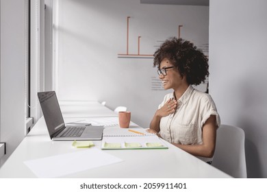 Afro American Woman Learning And Communicating In Sign Language Online While Sitting Near Window