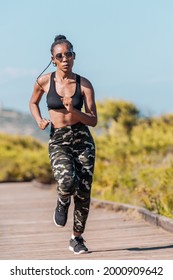 Afro American Woman Running On A Wooden Runway