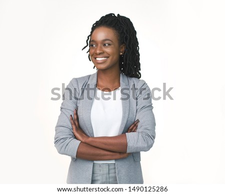 Afro Business Lady Posing Crossing Hands Looking Aside Isolated Over White Studio Background. Free Space