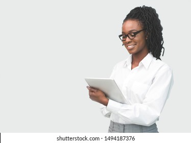 Afro Business Lady Using Tablet Computer Reading Digital Book On White Studio Background. Mockup, Isolated, Free Space