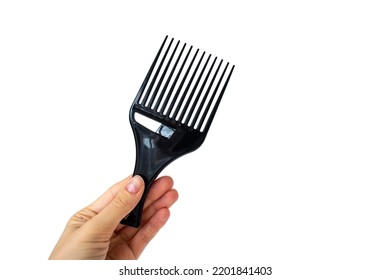 Afro Hair Pick, AfroPick Black Hair Comb Curly In A Woman's Hand On An Isolated White Background.