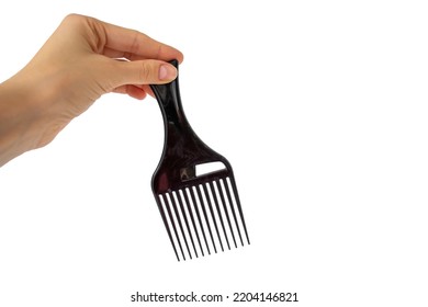 Afro Hair Pick, AfroPick Black Hair Comb Curly In A Woman's Hand On An Isolated White Background.