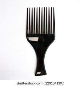 Afro Hair Pick, AfroPick A Comb For Curly Hair On Isolated White Background.