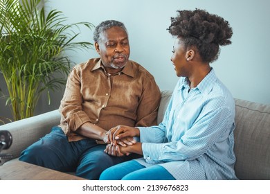 Afro hispanic-latino father and daughter together at home. Family is everything - Family Tie. Adult Daughter Hugging Senior Man. Senior black man and his middle aged daughter embracing, close up