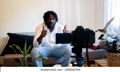 Afro male blogger digital content creator records a video for his followers