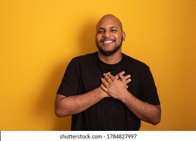 Afro Man Gratitude In Yellow Background
