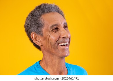 Afro senior citizen smiling with space for text on the side