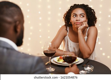 Afro Woman Feeling Bored At First Date At Restaurant, Couple Having Dinner, Drinking Wine