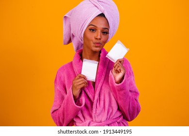 Afro Woman Holding Menstrual Pads