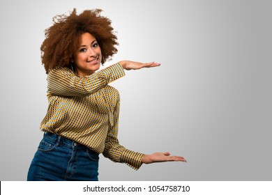 Afro Woman Holding Something