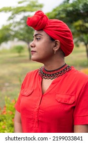 Afro Woman Looking To The Side With A Turban In Park