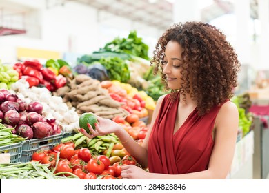 Afro Woman Shopping Organic Veggies And Fruits