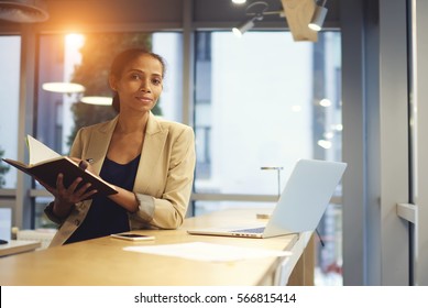 Afroamerican Business Coach Checking Report Of University Student While Checking Data Information From Official Web Site Surfing Internet Using Laptop Computer Connected To Free Wireless Network