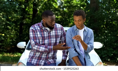 Afro-american Dad Demanding Car Key Teenage Son Car Background, Parent Control